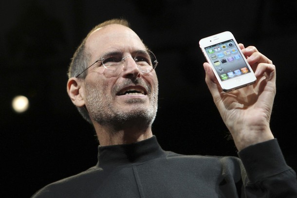 Apple CEO Steve Jobs poses with the new iPhone 4 during the Apple Worldwide Developers Conference in San Francisco, California
